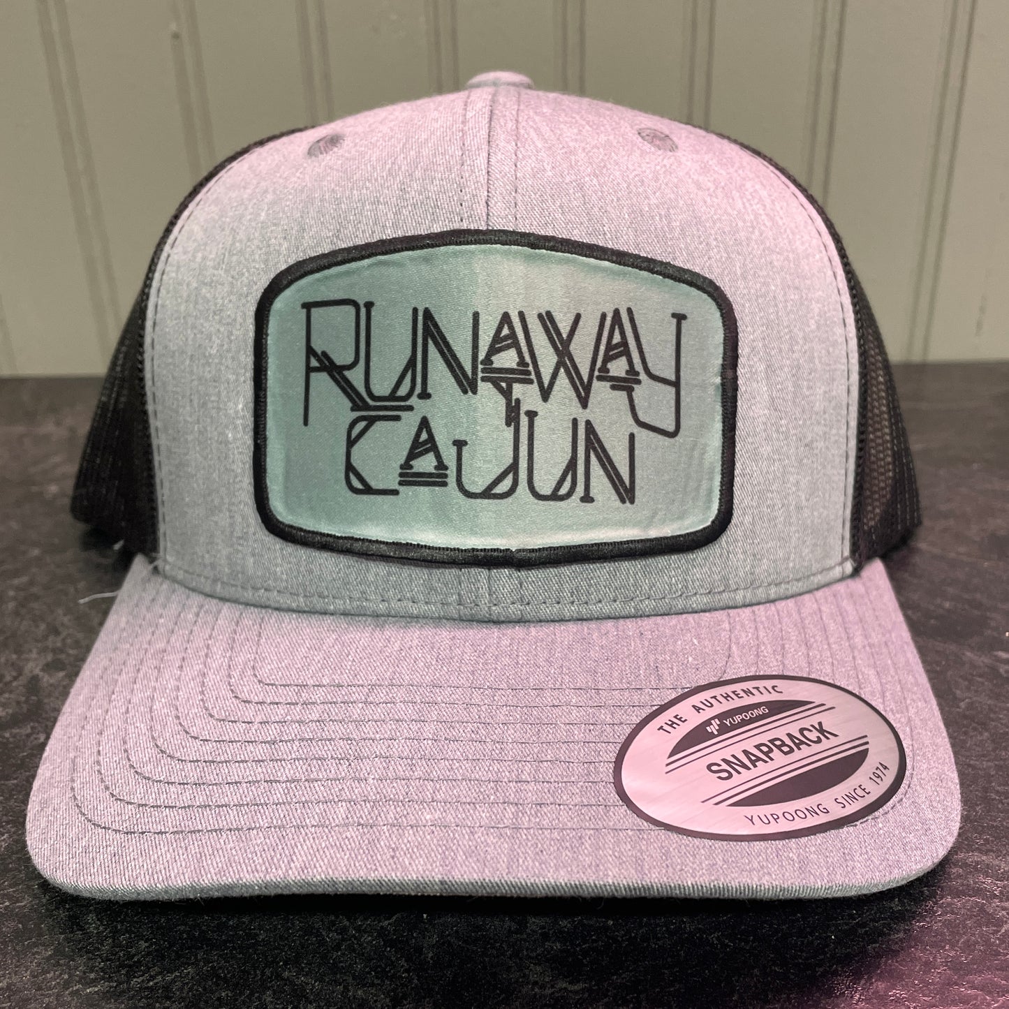 Runaway Cajun Cryptid Trucker Cap